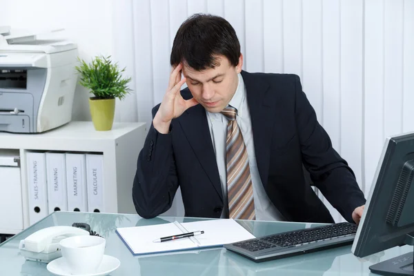 Businessman in office thinking on problem — Stock Photo, Image