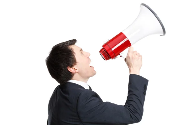 Businessman isolated on white shouts in loudspeaker — Stock Photo, Image