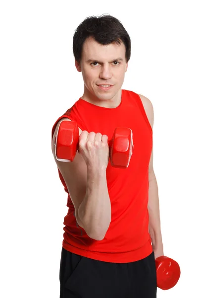 Sporty man with dumbbells in the hands — Stok Foto