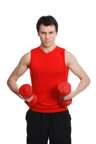 Sporty man with dumbbells in the hands — Stok Foto