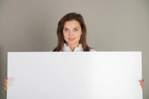 Female doctor with blank ad — Stock Photo, Image