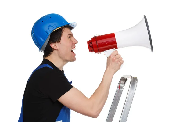 Joven trabajador con casco azul gritando en aislamiento de altavoz — Foto de Stock