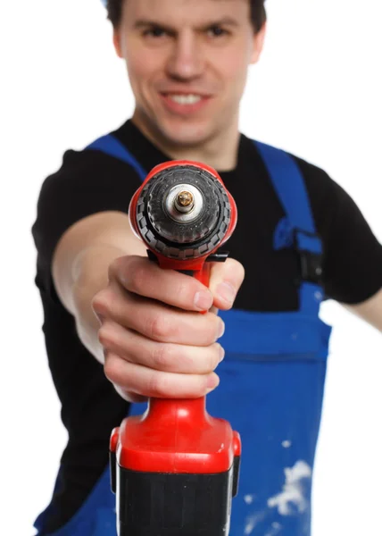 Handyman sorrindo para câmera segurando broca — Fotografia de Stock