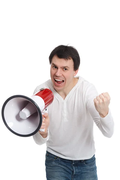 Handsome young man isolated on white shouts in loudspeaker — Stock Photo, Image