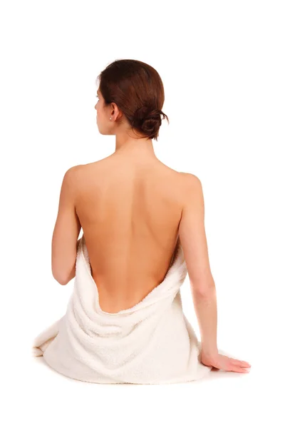 Beautiful woman in spa sitting with a back — Stock Photo, Image