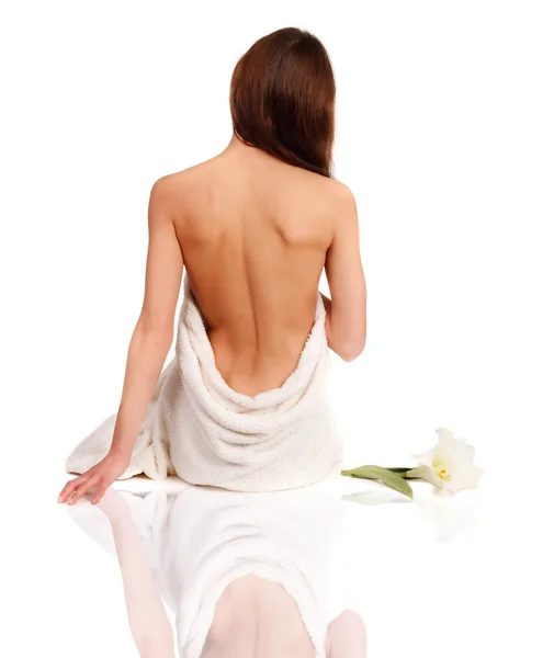 Beautiful woman in spa sitting with a back — Stock Photo, Image