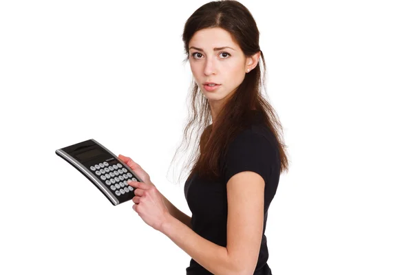 Beautiful girl counts on the calculator — Stock Photo, Image