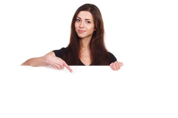 Attractive girl pointing to blank ad — Stock Photo, Image
