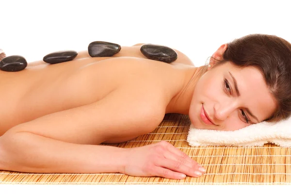 Bild einer Frau im Wellness-Salon mit heißem Stein — Stockfoto
