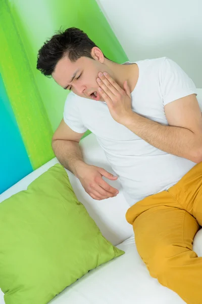 Young man has a teeth pain — Stock Photo, Image