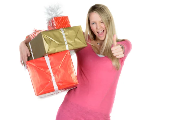 Beautiful girl with many present boxes shows thumb up — Stock Photo, Image