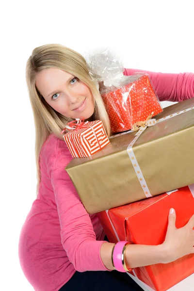 Beautiful girl with many present boxes smiles — Stock Photo, Image