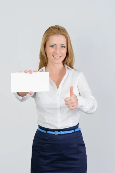 Attractive businesswoman shows thumb up and blank business card — Stock Photo, Image