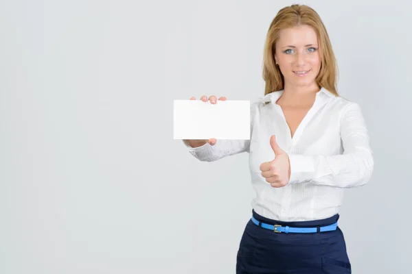 Attractive businesswoman shows thumb up and blank business card — Stock Photo, Image