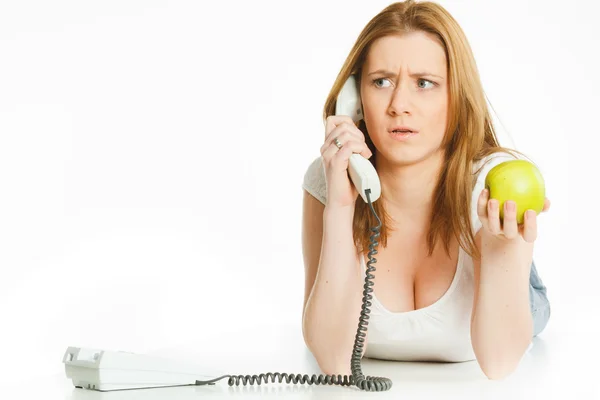 Attractive young woman angry talking at telephone — Stock Photo, Image