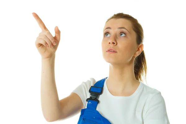 Beautiful young woman doing repairs in blue coverall — Stock Photo, Image