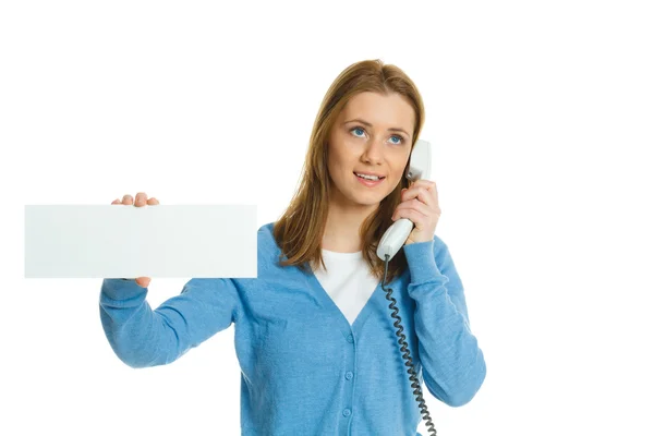 Atractiva joven con pancarta publicitaria en blanco y teléfono — Foto de Stock