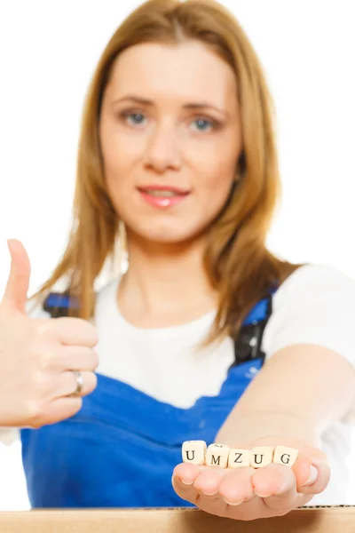 Woman with moving boxes shows thumb up — Stock Photo, Image