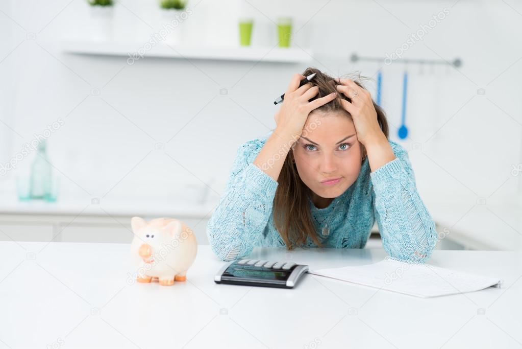 attractive woman calculating houshold costs