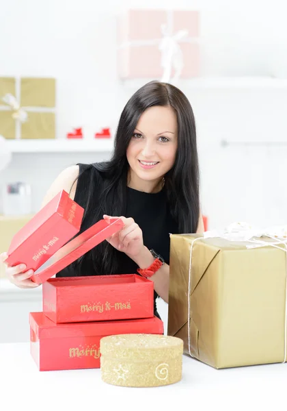 Beautiful girl with christmas gifts — Stock Photo, Image