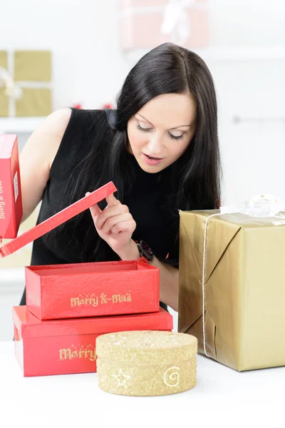 Beautiful girl with christmas gifts — Stock Photo, Image