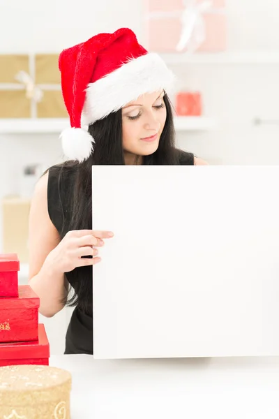 Santa girl with blank ad — Stock Photo, Image