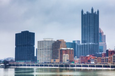 The Pittsburgh skyline in winter clipart