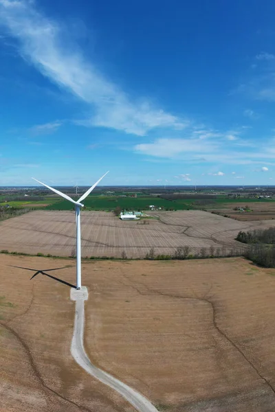 An aerial vertical of a wind turbine on a beautiful day
