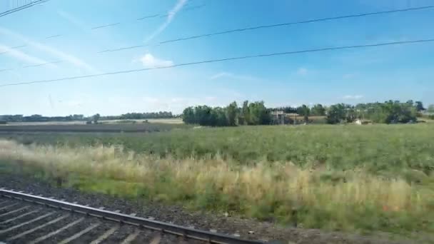 Słoneczny wiejski widok z pociągu — Wideo stockowe