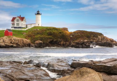 Nubble Light in Maine on a sunny day clipart