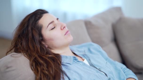 Young Woman Closed Eyes Resting Couch Attractive Adult Girl Relaxes — Stock Video