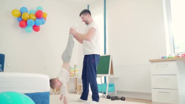 Funny Cheerful Young Father Playing His Son Nursery Happy Spend — Stock Video