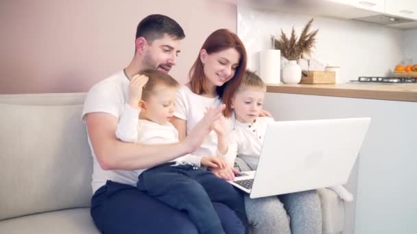 Young Happy Family Dad Mom Young Children Communicates Online Laptop — Stock Video