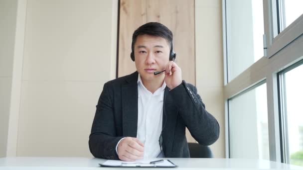 Young Asian Man Headset Conducts Online Consultation Meeting Conference Looking — Stock Video