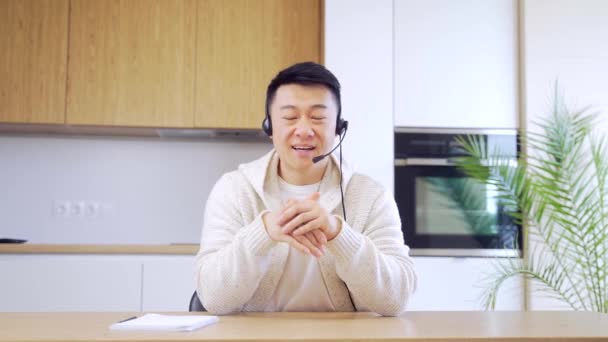 Asian Man Talking Online Video Call Home Room Headset Male — Stock Video