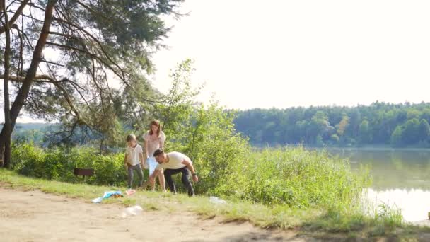 Family Volunteer Cleans Garbage Nature Father Mother Parents Children Son — Stock Video