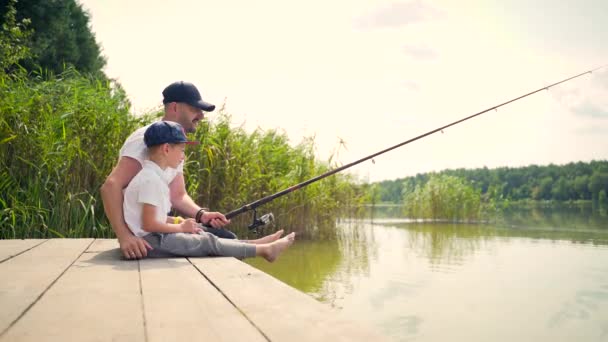 Father Little Children Son Catches Fish Standing Wooden Bridge Pier — Stock Video