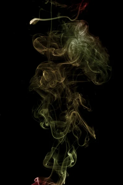 Colorful smoke on the black background — Stock Photo, Image