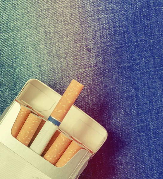Closeup to jeans pocket with cigarettes