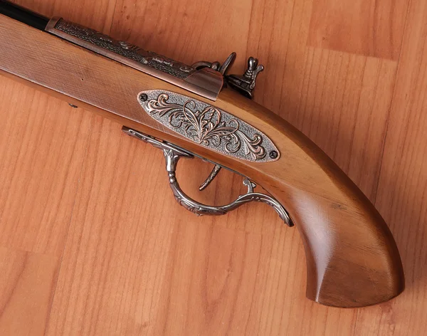 Vintage pistols on wooden background — Stock Photo, Image