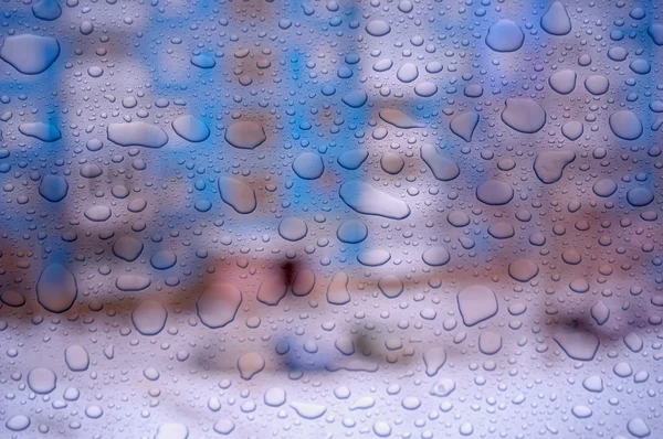 Gotas de agua en un vaso de ventana después de la lluvia —  Fotos de Stock