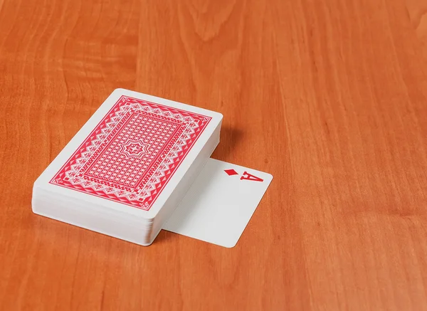 Old playing cards on wooden background — Stock Photo, Image