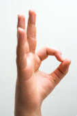Az ujjakat összekötő kéz a siker szimbóluma.