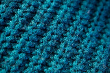 Bir süveterin mavi ve pembe yün dokusunu kapat 
