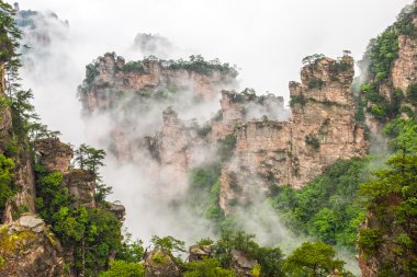 Misty steep mountain peaks - Zhangjiajie national park,China clipart
