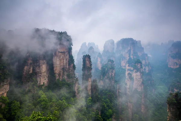 Misty steep mountain peaks - Zhangjiajie national park,China — Stock Photo, Image