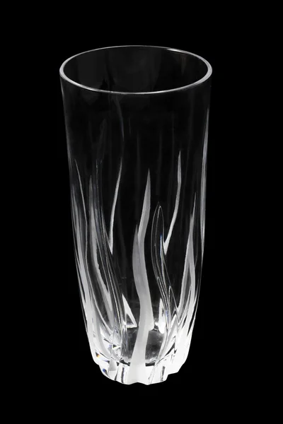 Empty crystal glass for juice or water on a black background — Stock Photo, Image