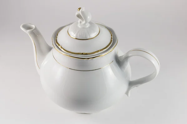 Porcelain teapot with gold border — Stock Photo, Image