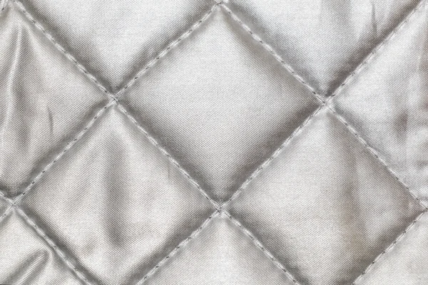 A textura de tecido brilhante costurado quadrados — Fotografia de Stock