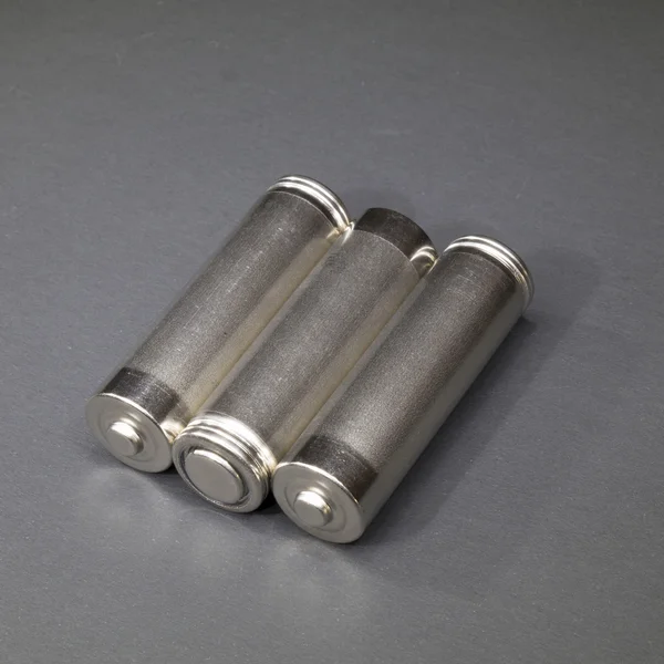 Três pilhas de metal AA tamanho — Fotografia de Stock